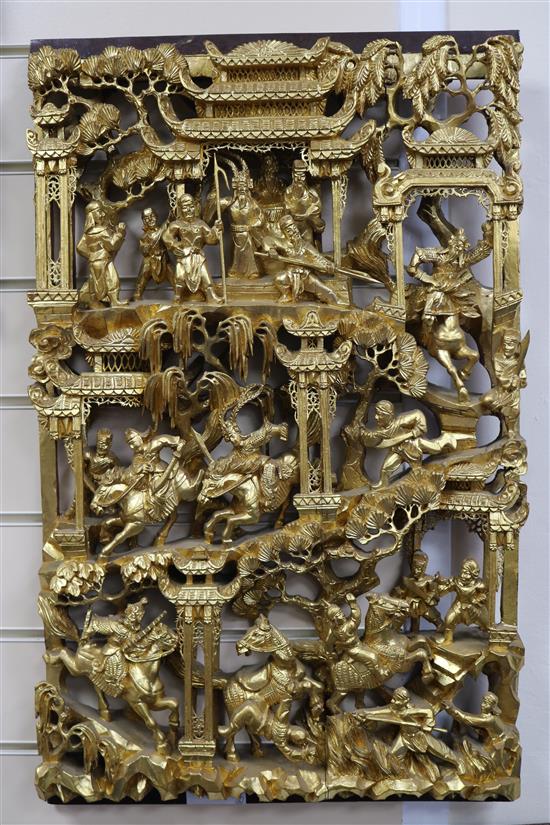 Six Chinese carved giltwood panels of soldiers amid pavilions